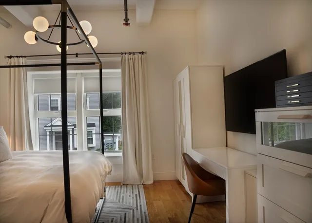 a view of a hallway with furniture and entryway