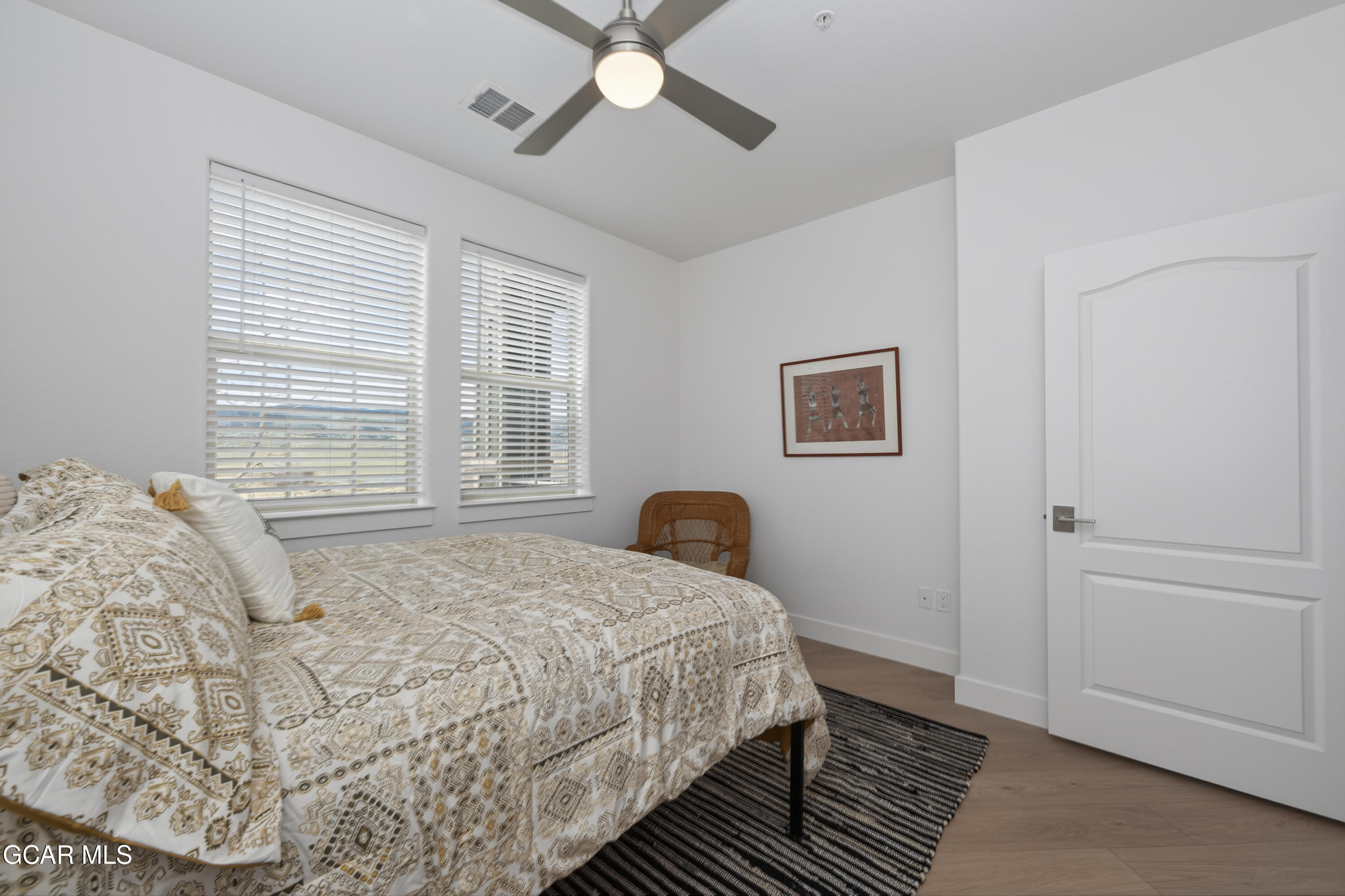 160 Village Road, Unit F207 Granby, CO 80446 - Photo 13 of 28 a bedroom with a bed and window