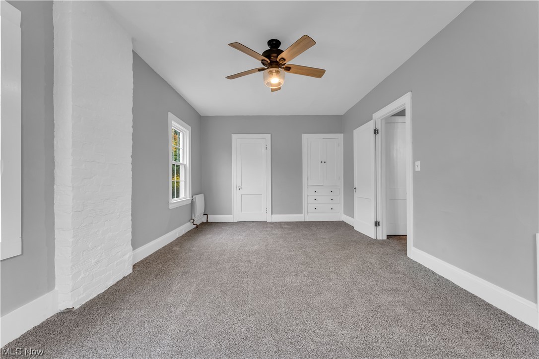 2640 Edgehill Road Cleveland, OH 44106 - Photo 20 of 35 Empty room with ceiling fan and carpet floors