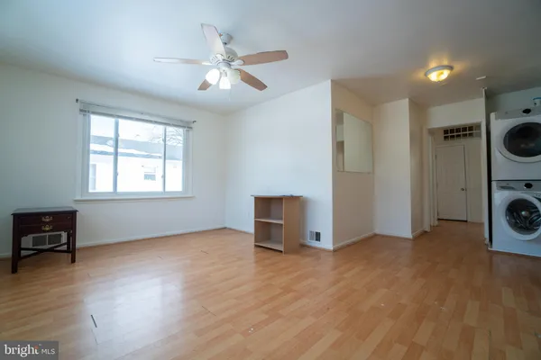 a view of livingroom with furniture wooden floor and window