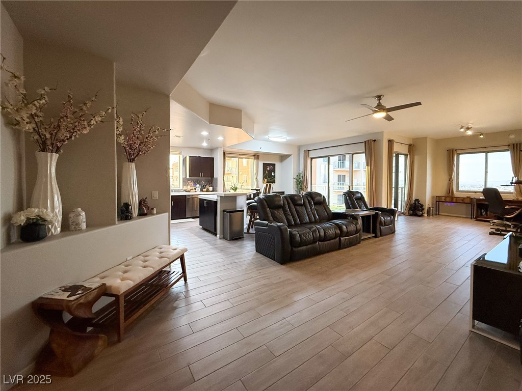 From entry, Great room with healthy amount of natural light and Ceramic plank tiles