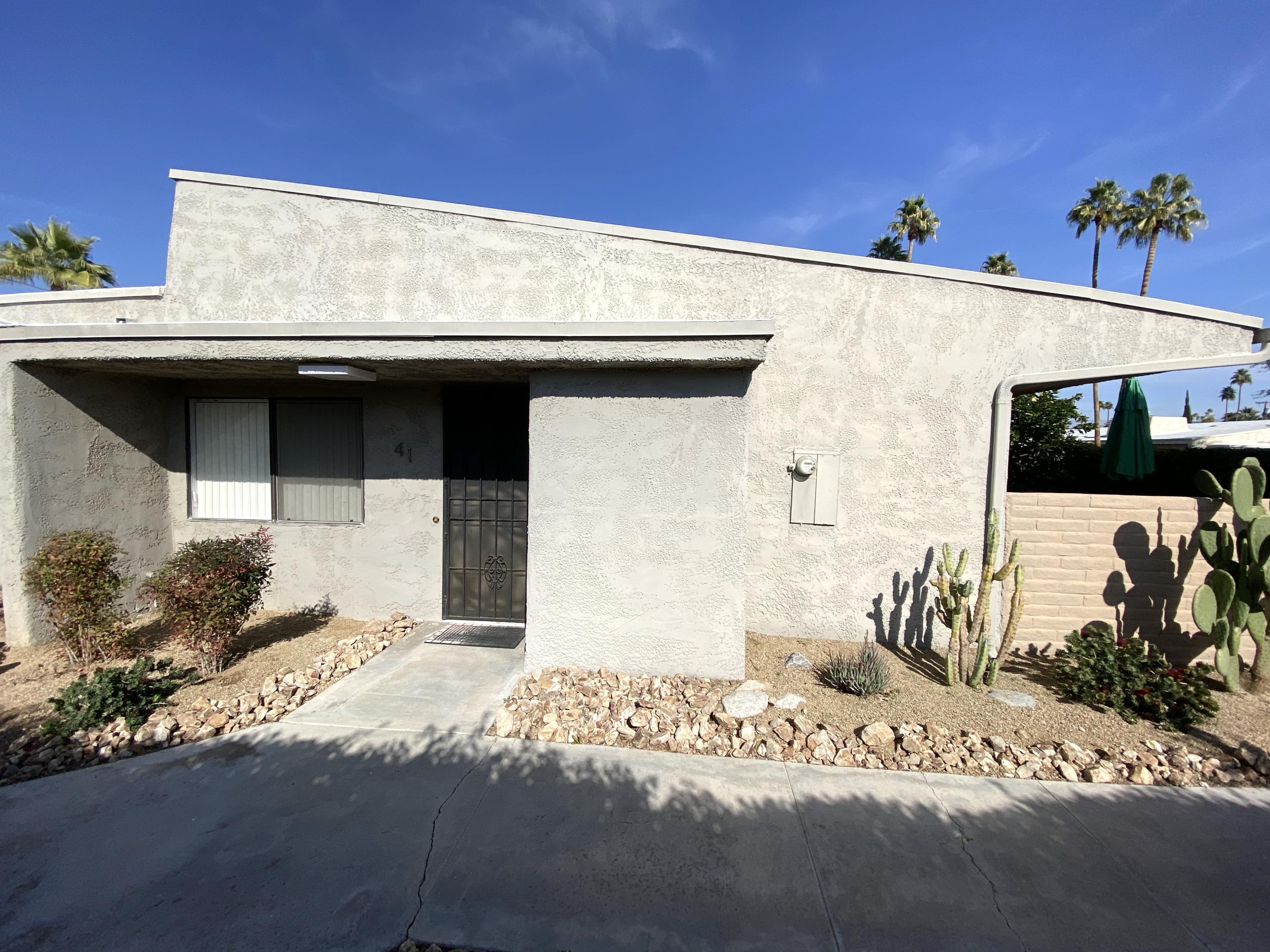 a front view of a house with a garage