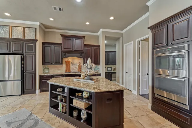 a bathroom with a double vanity sink mirror and shower