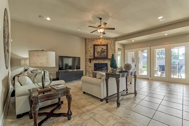 a view of a workspace with furniture and a flat screen tv