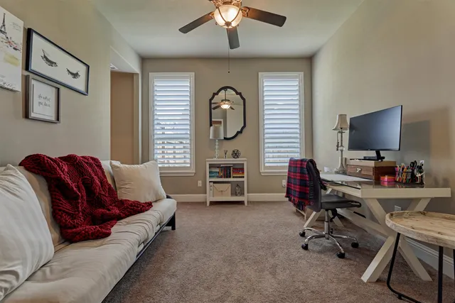 a dining room with furniture water view and a large window