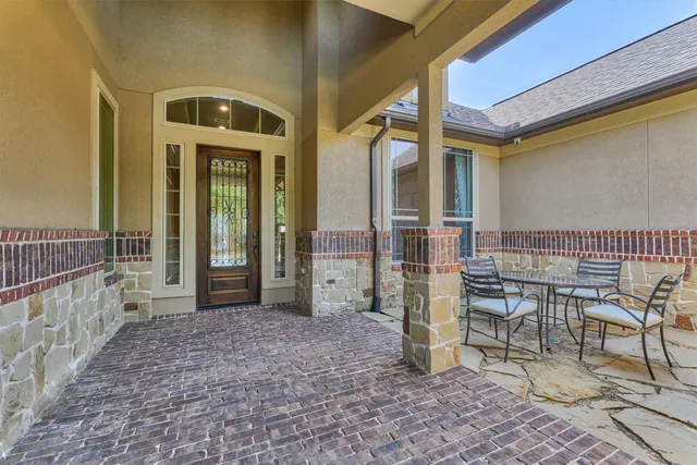 a view of a workspace with furniture and wooden floor