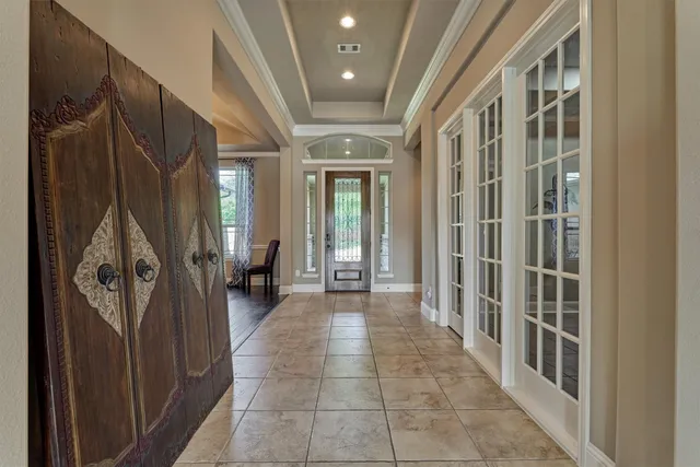 a kitchen with stainless steel appliances granite countertop a stove top oven a sink dishwasher a dining table and chairs