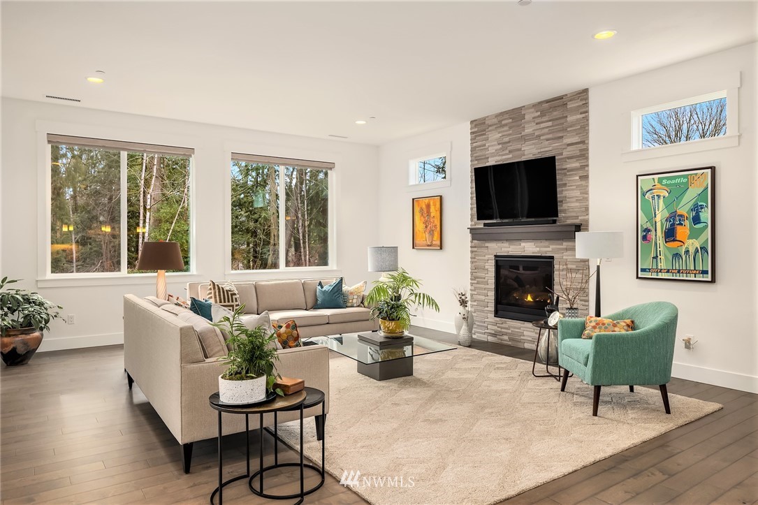 36234 Southeast Fish Hatchery Road Fall City, WA 98024 - Photo 10 of 33 a living room with furniture a flat screen tv and a fireplace