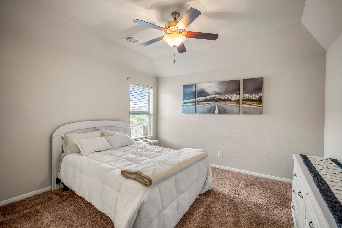 23006 Mulberry Tree Lane Spring, TX 77389 - Photo 37 of 50 Upstairs bedroom with neutral tones, soft carpet, and natural light—ready for guests or personal retreat.