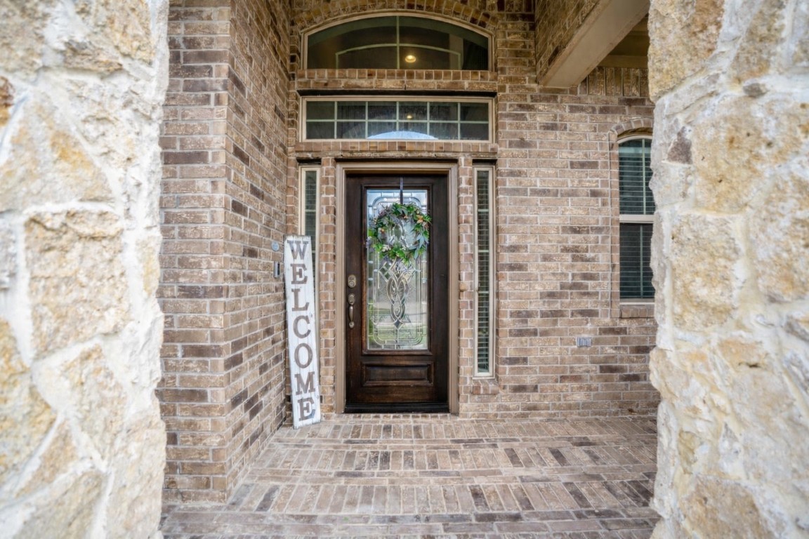 23006 Mulberry Tree Lane Spring, TX 77389 - Photo 4 of 50 Brick and stone accents frame the welcoming front entry, offering a first glimpse of the style and comfort inside.