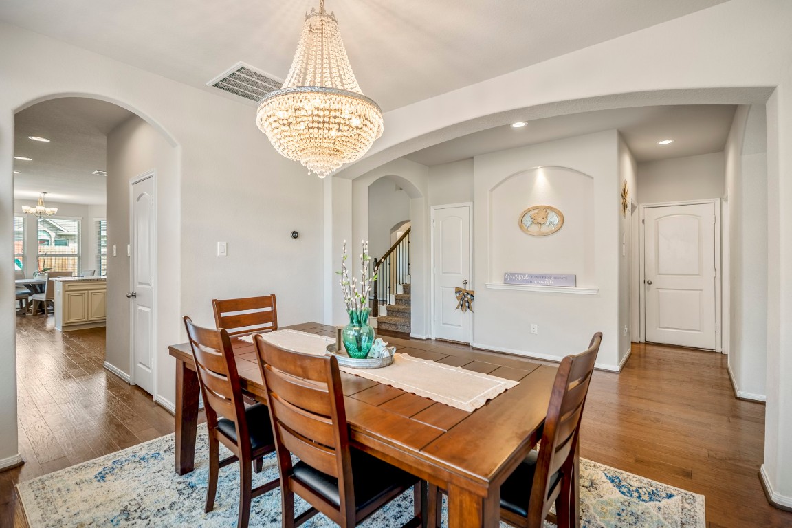 23006 Mulberry Tree Lane Spring, TX 77389 - Photo 10 of 50 From the dining room, the layout flows easily toward the kitchen, breakfast area, and main living space, with the staircase tucked neatly to the side.