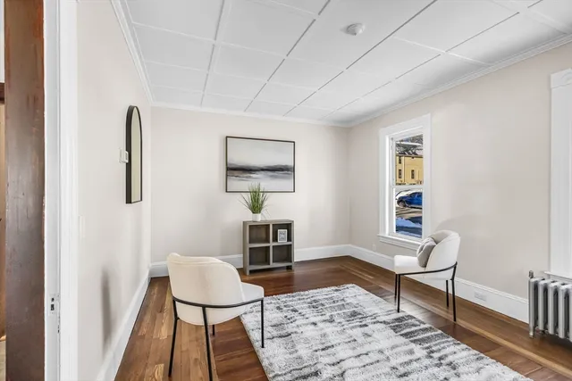 a living room with furniture and a rug