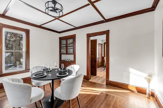 a dining room with furniture and window