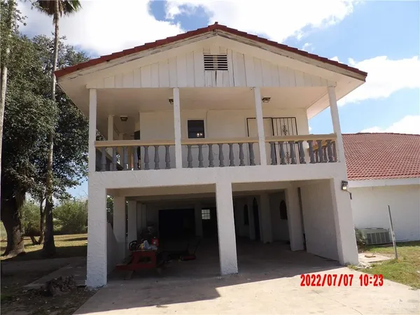 a view of house with outdoor space