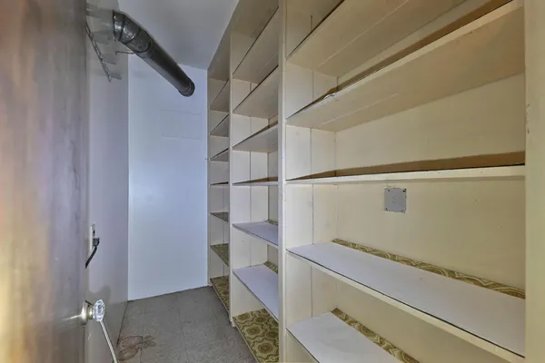 a kitchen with stainless steel appliances granite countertop a refrigerator a stove top oven a sink and dishwasher