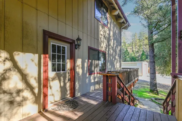 a view of balcony with wooden floor and outdoor seating