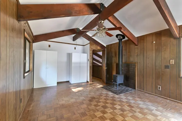 a view of an empty room with a fireplace