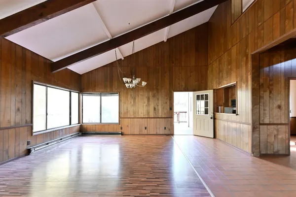 a view of a livingroom with wooden floor