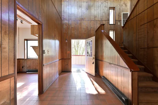 a view of gallery with wooden floor