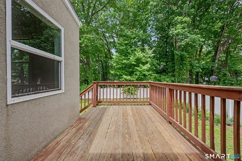 a view of balcony with wooden floor