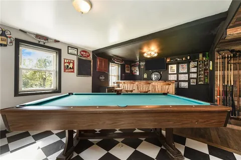 a view of a room with furniture and window