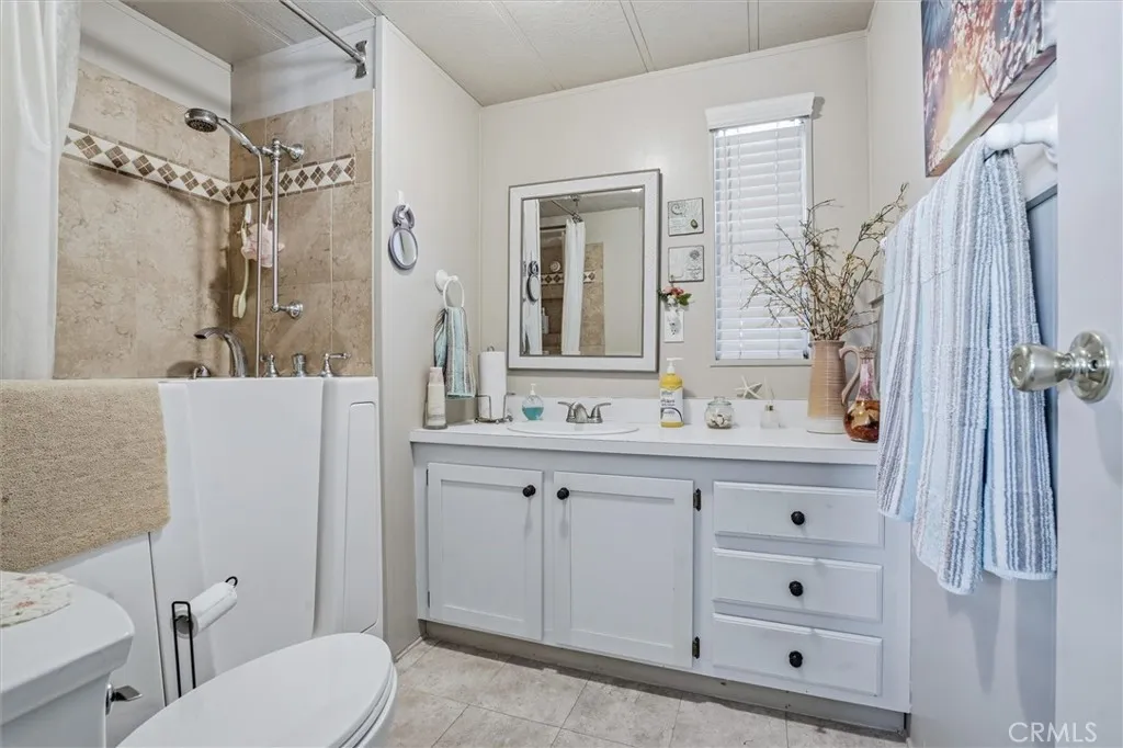 500 Atascadero, Unit D8 Morro Bay, CA 93442 - Photo 16 of 26 a bathroom with a sink a toilet and shower