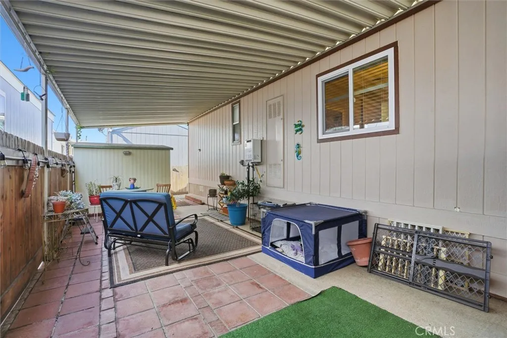 500 Atascadero, Unit D8 Morro Bay, CA 93442 - Photo 5 of 26 a building outdoor space with patio furniture and potted plants