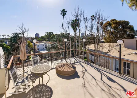 a room with rug and wooden floor