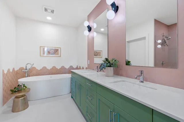 a bathroom with a sink a vanity and a mirror