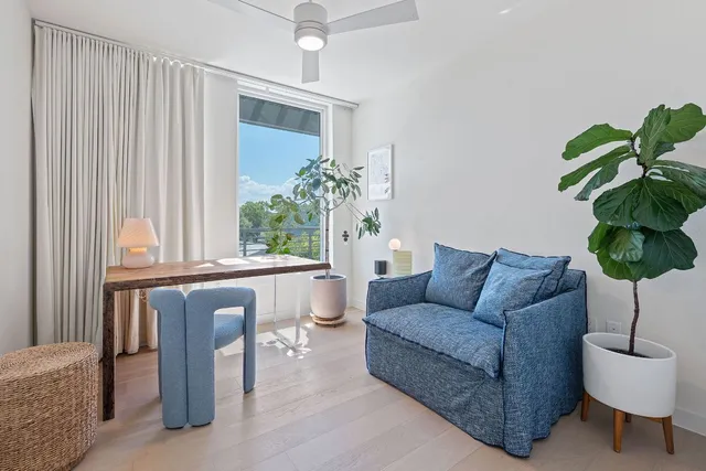 a flower pot sitting on a table near a window