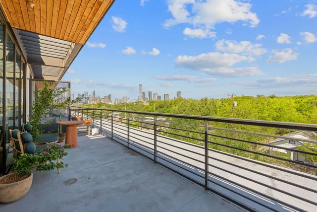 a view of balcony with furniture