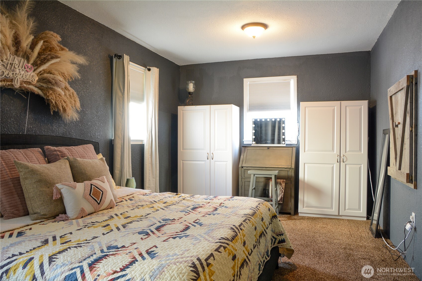 207 West 10th Avenue Ritzville, WA 99169 - Photo 12 of 36 a bedroom with a bed and a refrigerator