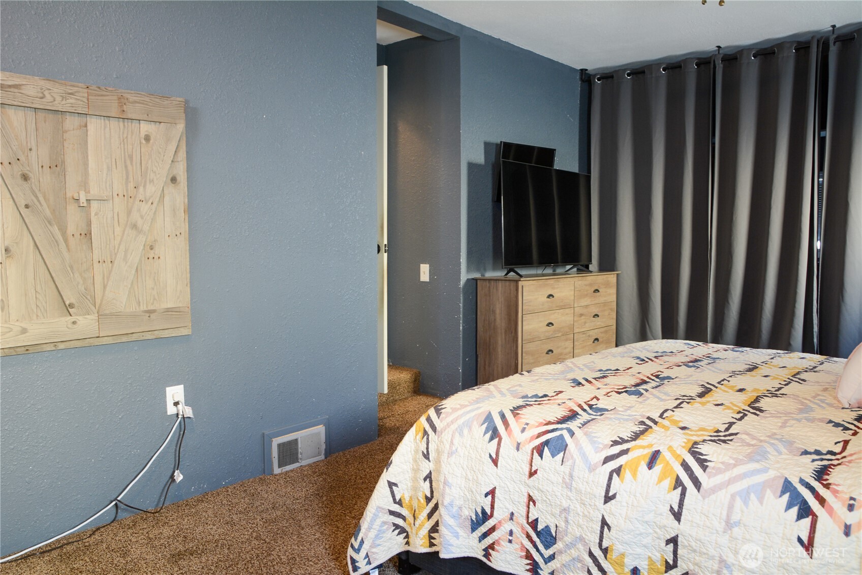 207 West 10th Avenue Ritzville, WA 99169 - Photo 13 of 36 a bedroom with a bed and a mirror