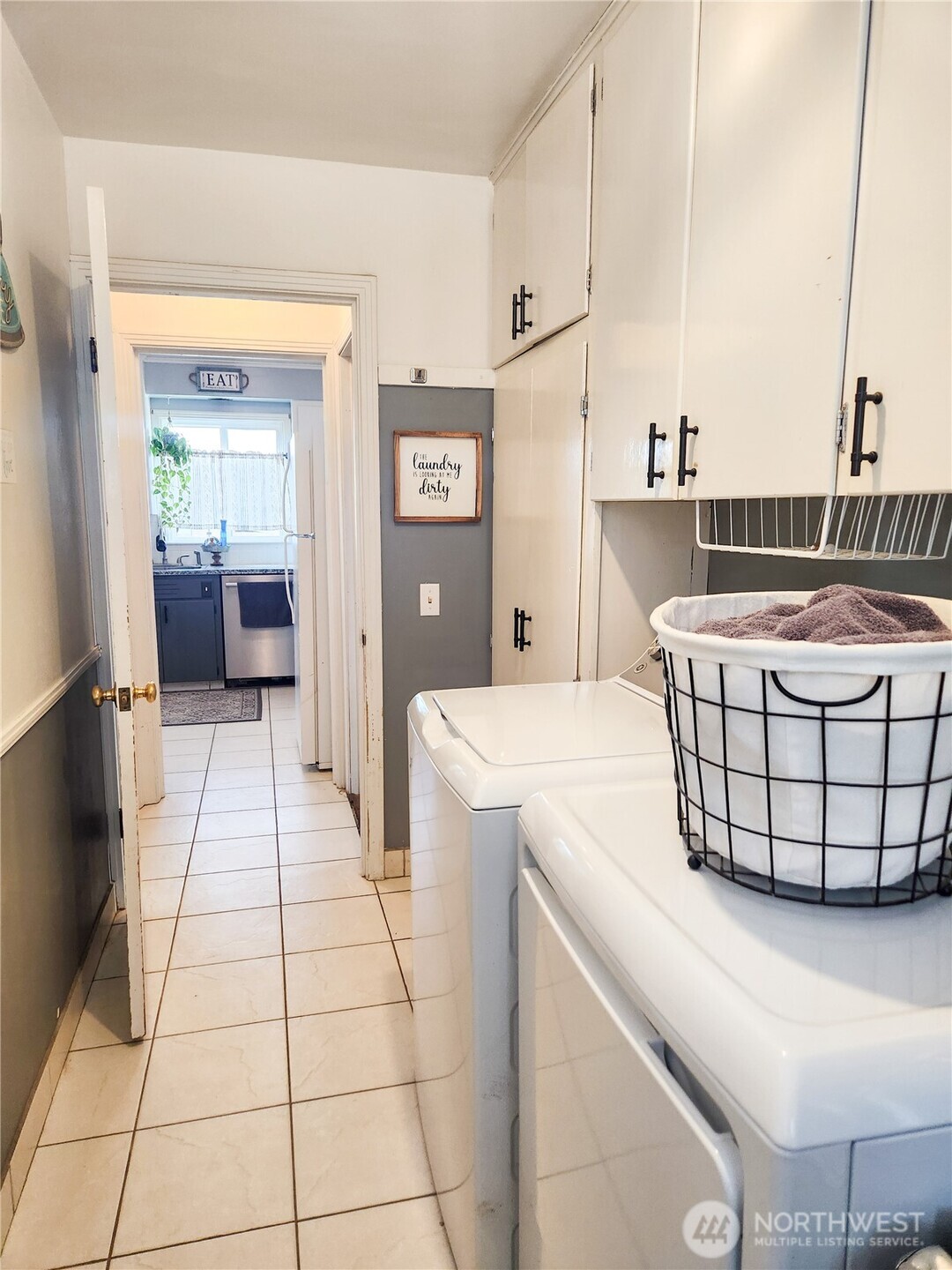 207 West 10th Avenue Ritzville, WA 99169 - Photo 15 of 36 a kitchen with a sink a refrigerator and cabinets