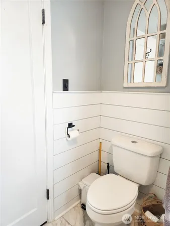 a bathroom with a toilet and a sink