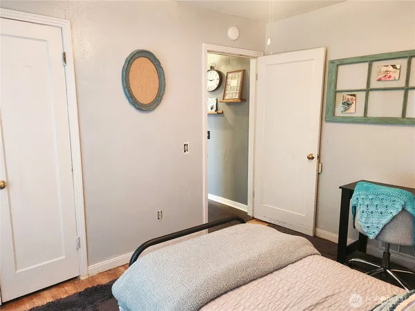 a bedroom with a bed and a closet