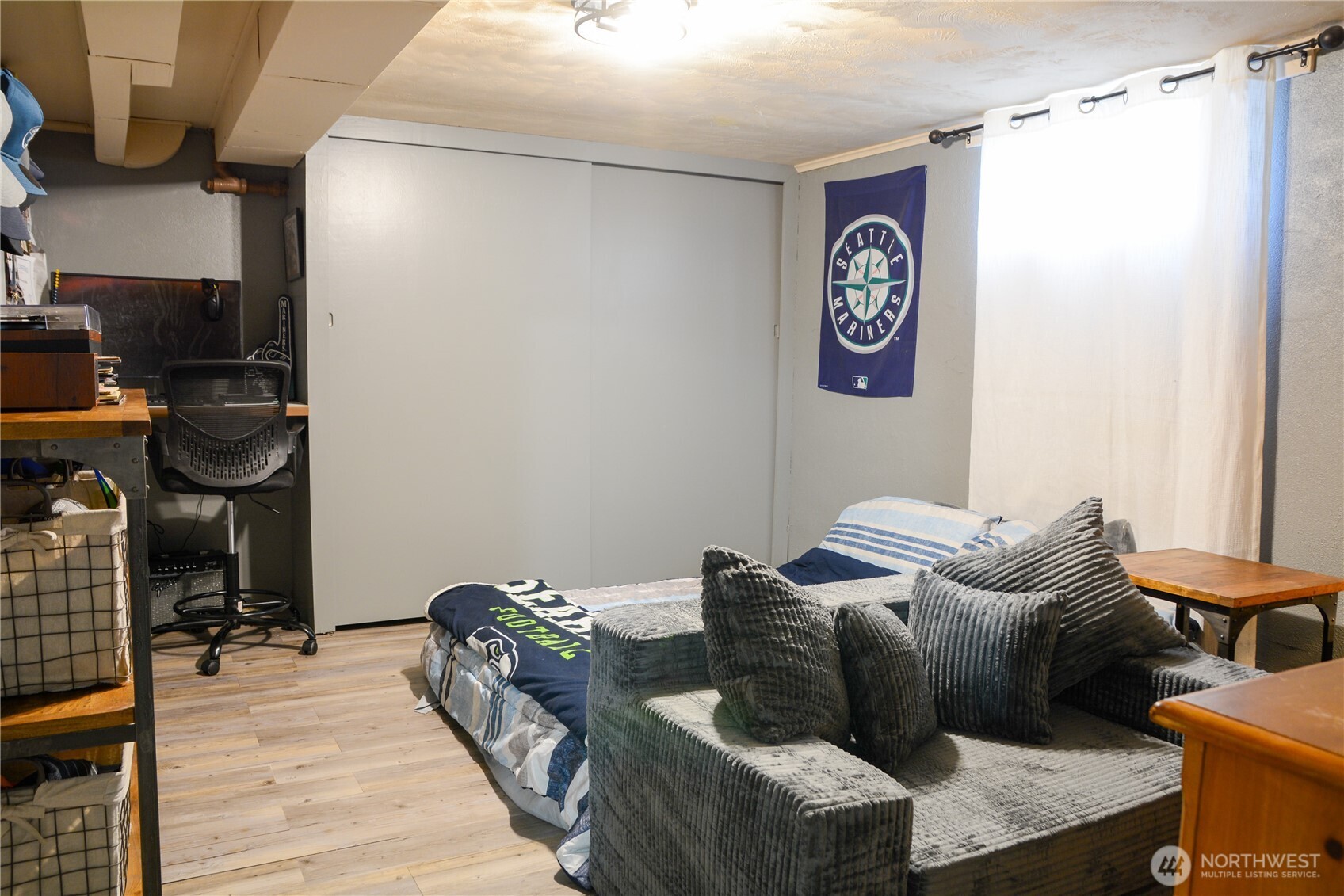 207 West 10th Avenue Ritzville, WA 99169 - Photo 22 of 36 a bedroom with a bed and wooden floor