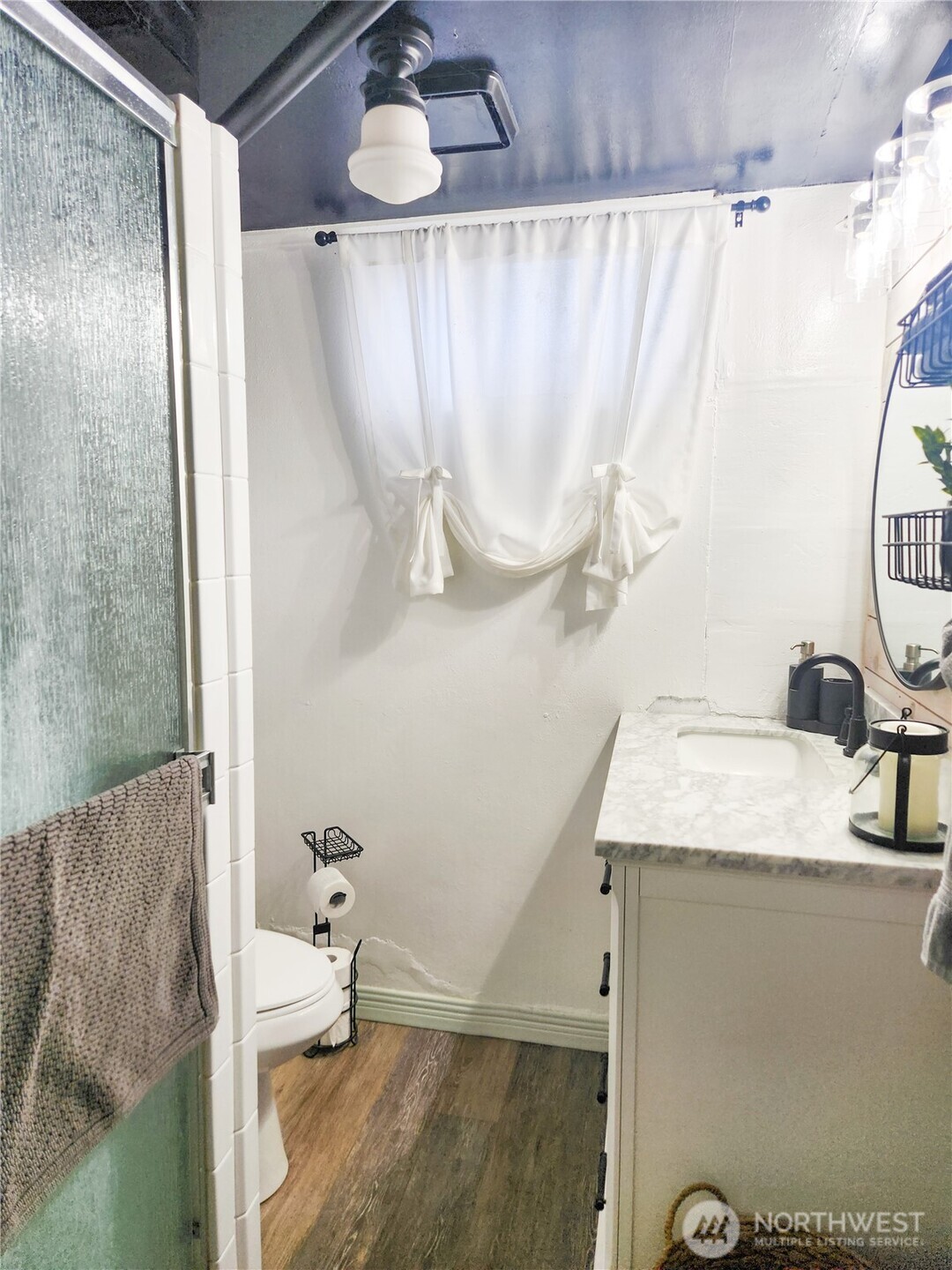 207 West 10th Avenue Ritzville, WA 99169 - Photo 27 of 36 a bathroom with a sink and a mirror