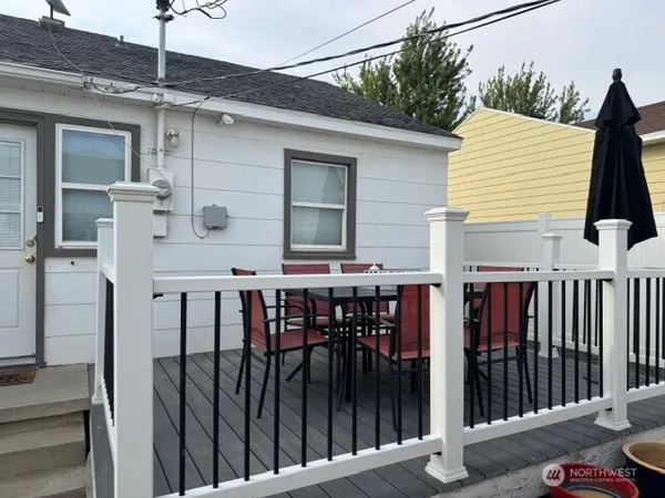 a view of a chairs and table on the deck