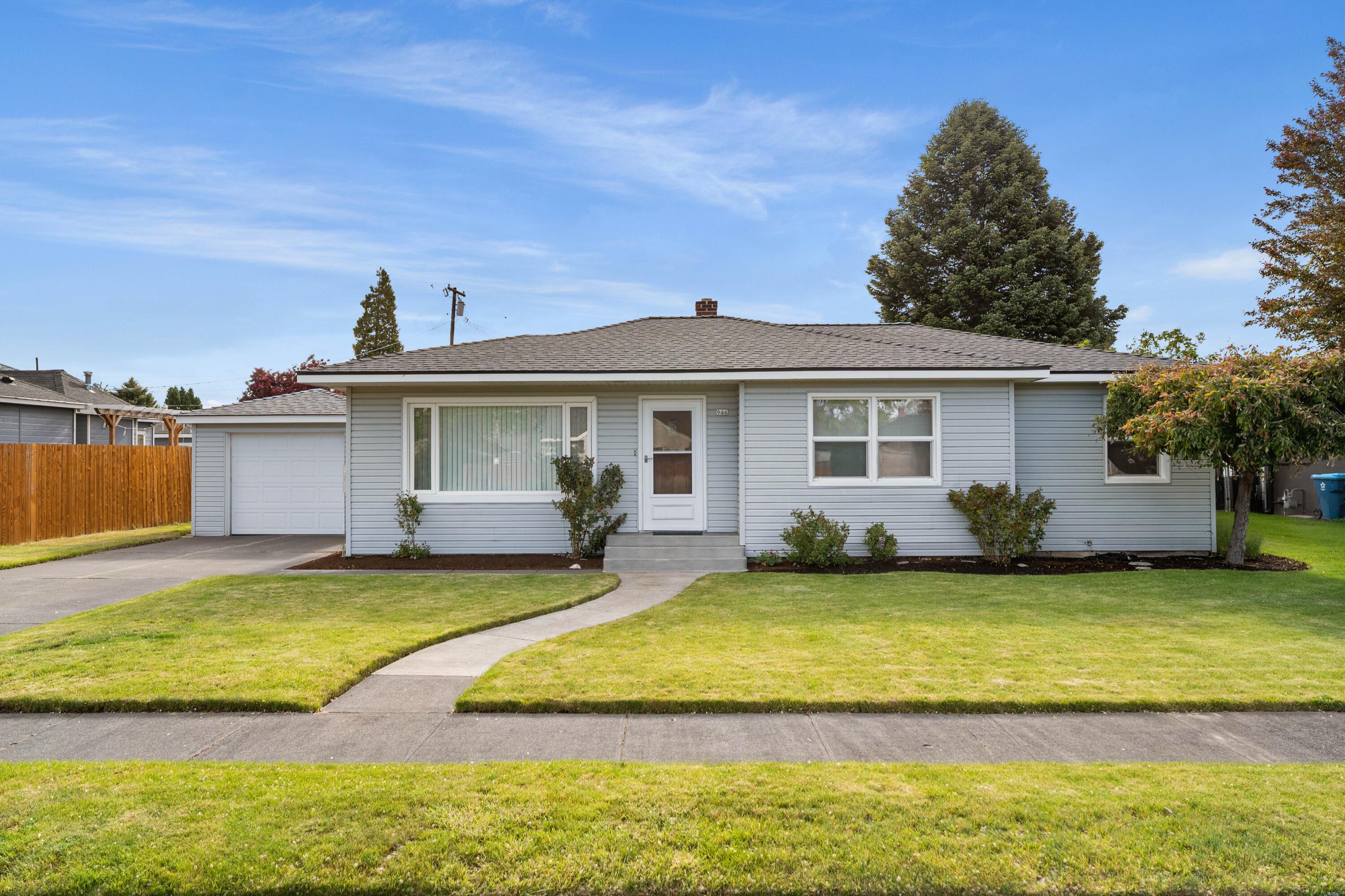 946 Southwest 13th Street Redmond, OR 97756 - Photo 1 of 49 a view of a house with a swimming pool and a yard