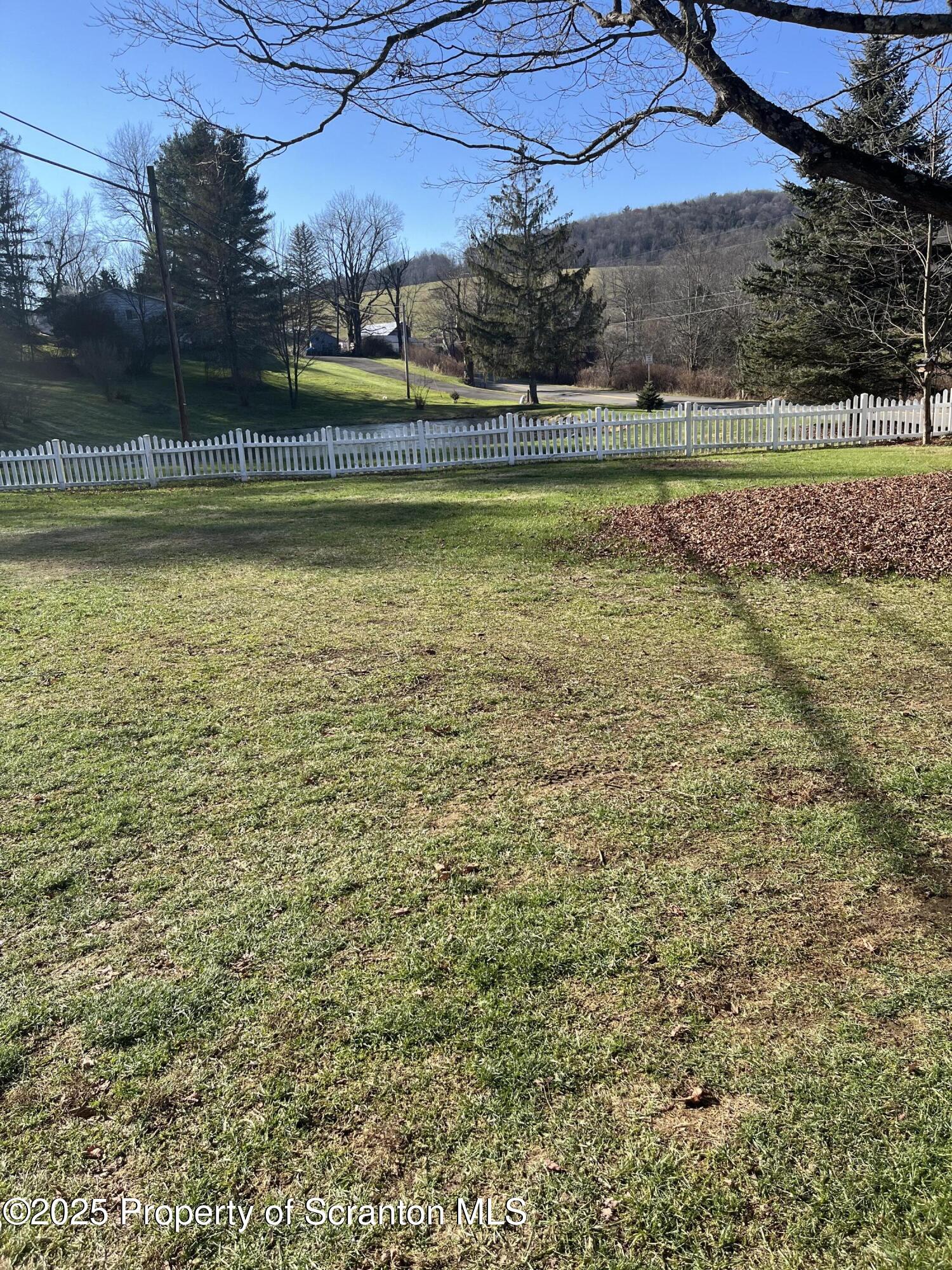 6666 Tingley Lake Road New Milford, PA 18834 - Photo 16 of 45 a view of a swimming pool with an outdoor seating