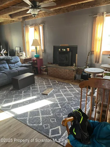 a living room with a couch and a potted plant