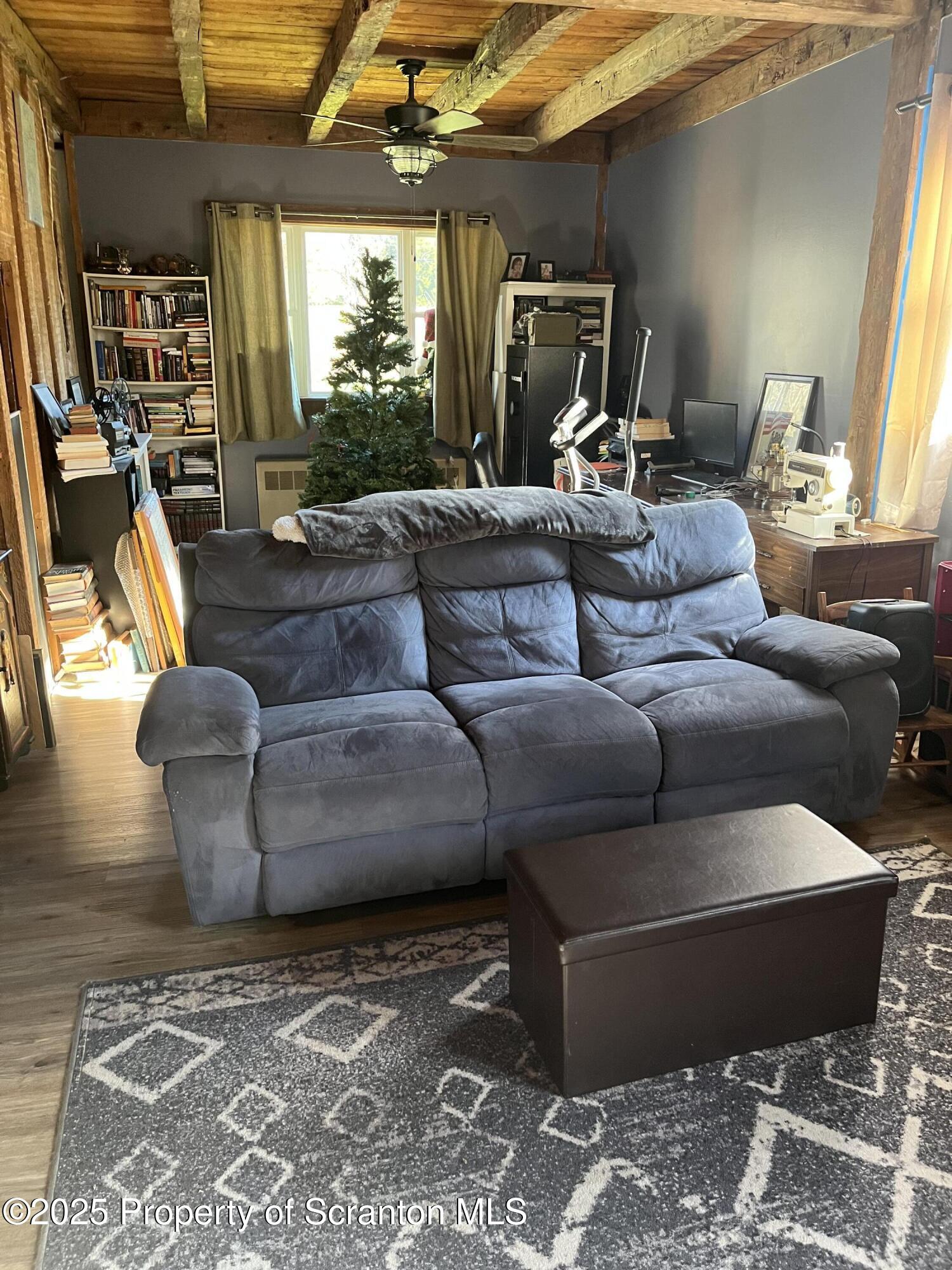6666 Tingley Lake Road New Milford, PA 18834 - Photo 20 of 45 a living room with furniture and a flat screen tv