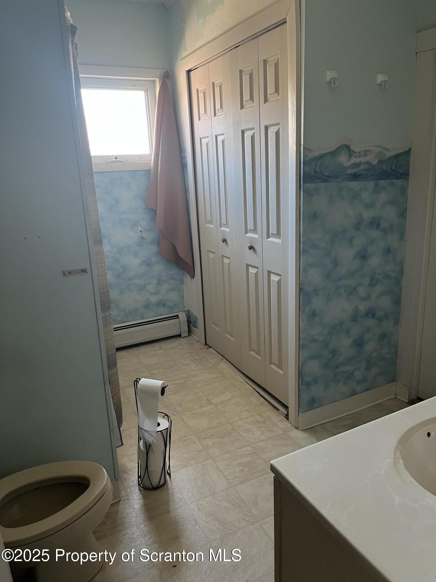 6666 Tingley Lake Road New Milford, PA 18834 - Photo 27 of 45 a bathroom with a shower and a toilet