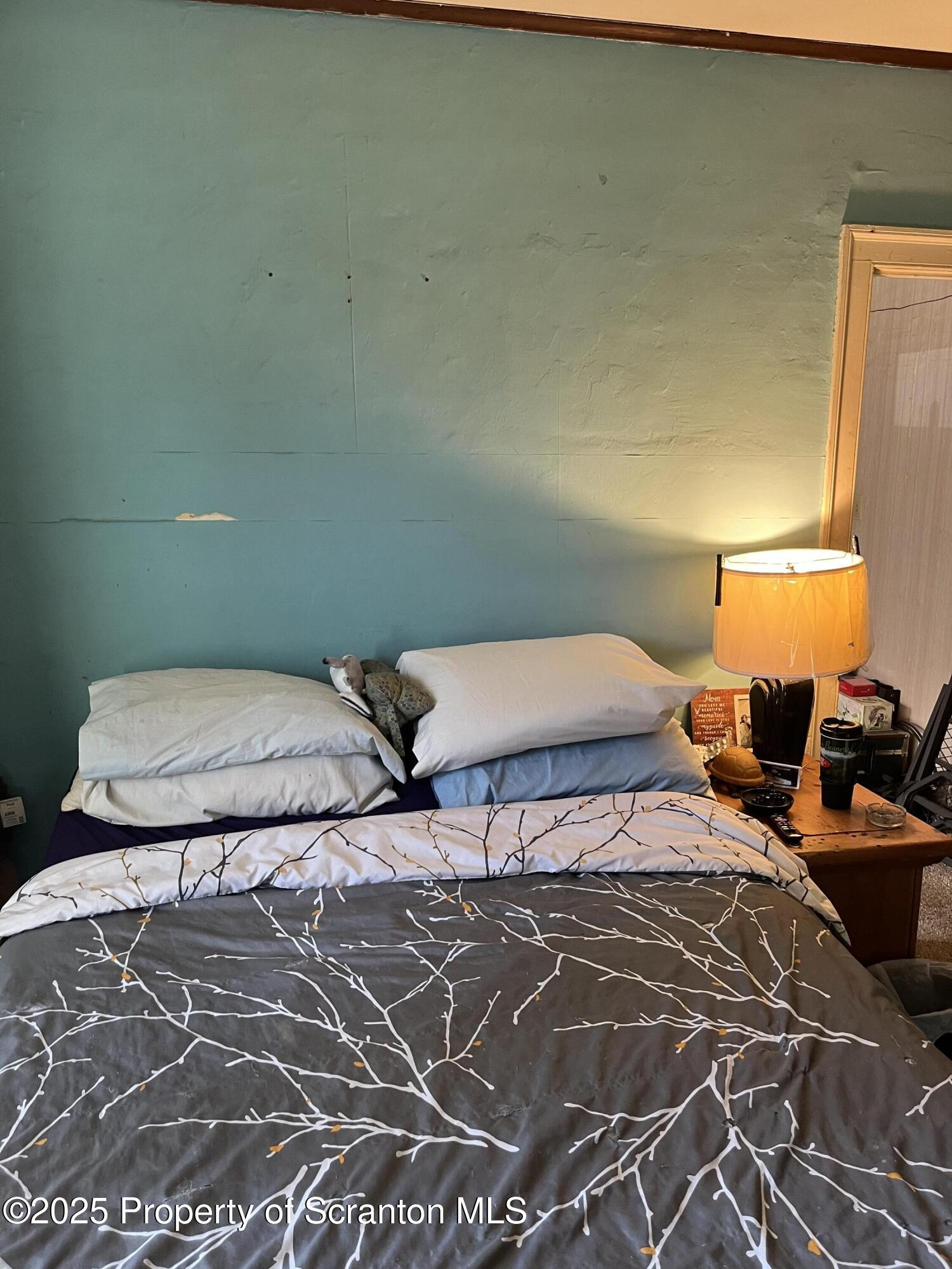 6666 Tingley Lake Road New Milford, PA 18834 - Photo 30 of 45 a bedroom with a bed and window