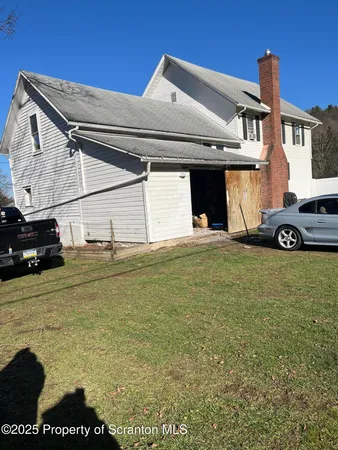 a view of a car in front of a house
