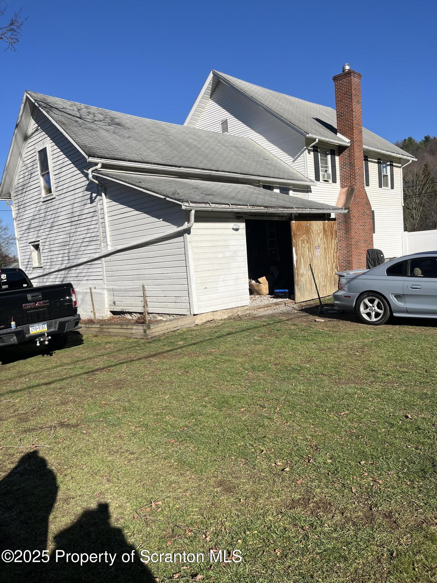 6666 Tingley Lake Road New Milford, PA 18834 - Photo 3 of 45 a view of a car in front of a house