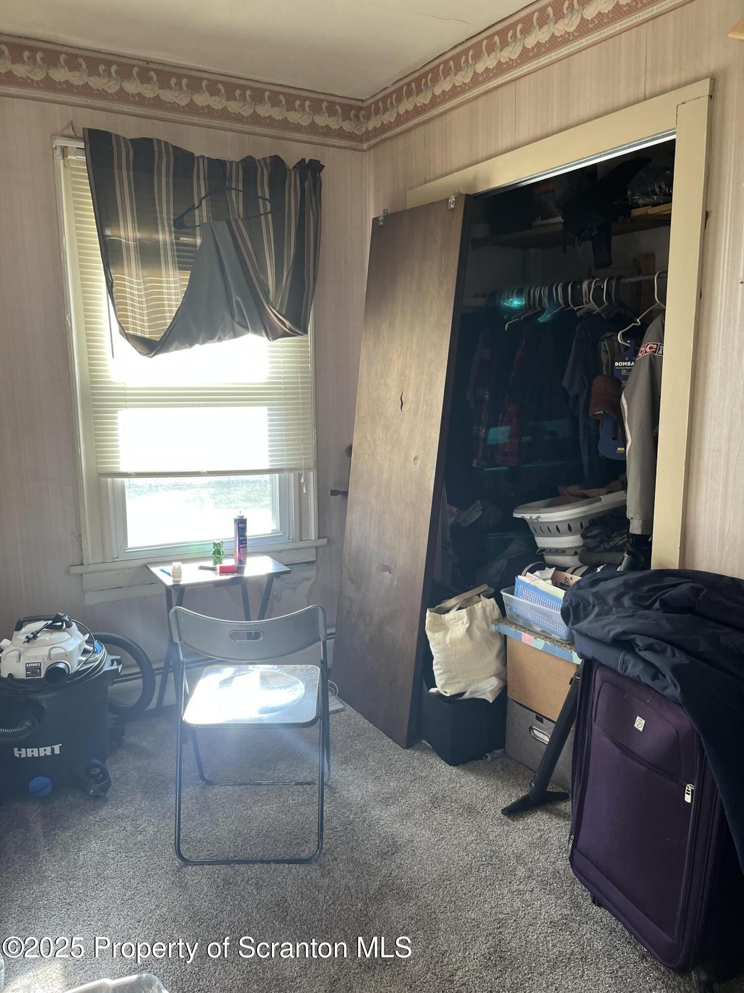 6666 Tingley Lake Road New Milford, PA 18834 - Photo 34 of 45 a living room with furniture and a window