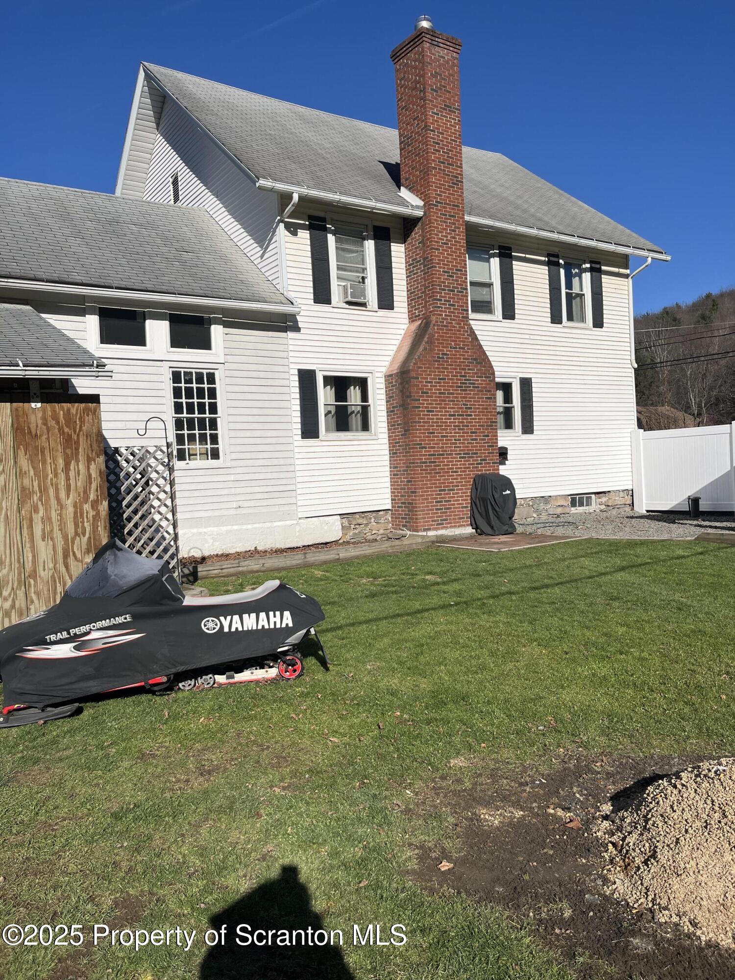 6666 Tingley Lake Road New Milford, PA 18834 - Photo 4 of 45 a front view of a house with a yard