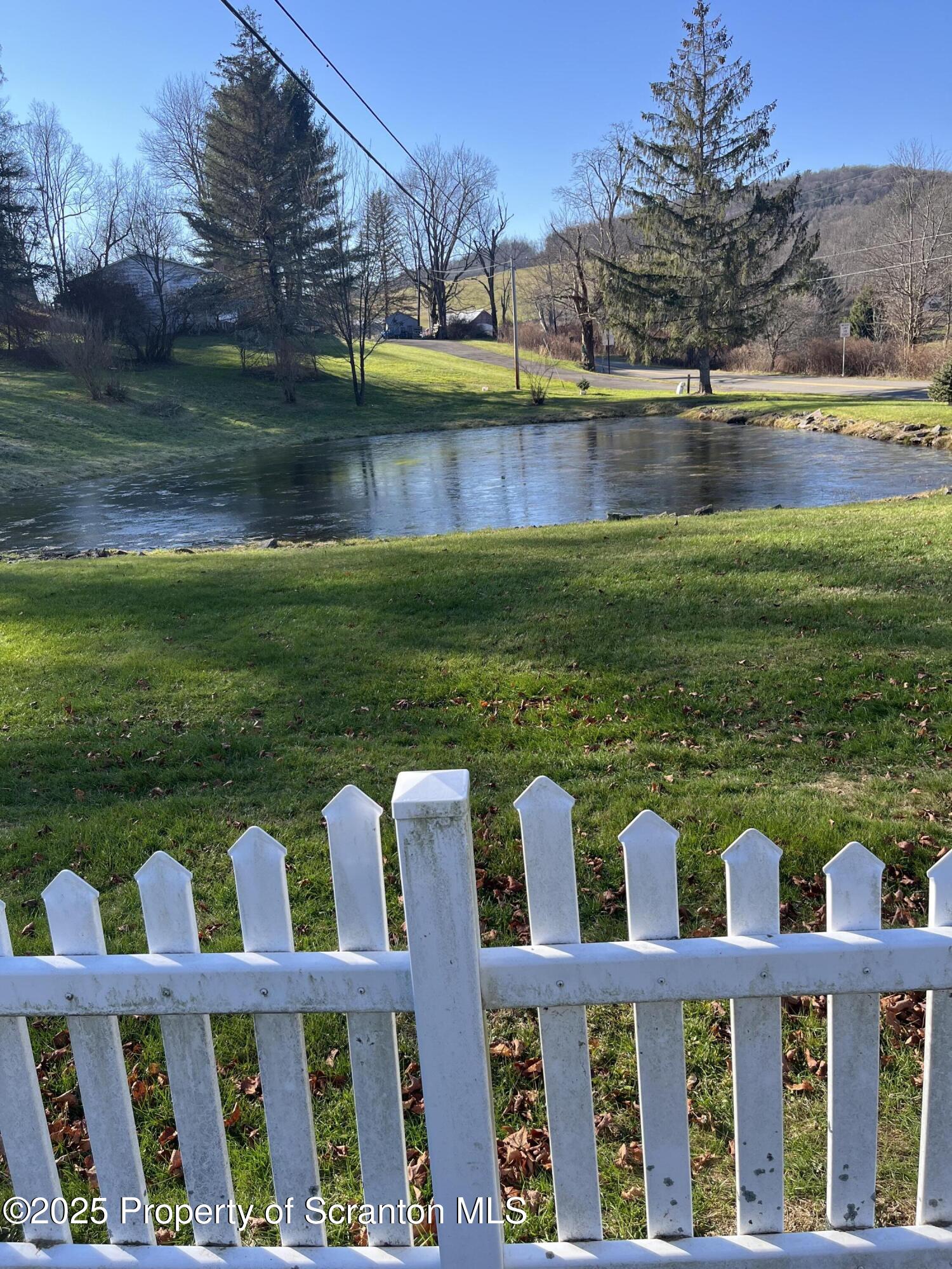 6666 Tingley Lake Road New Milford, PA 18834 - Photo 8 of 45 a view of house with a yard